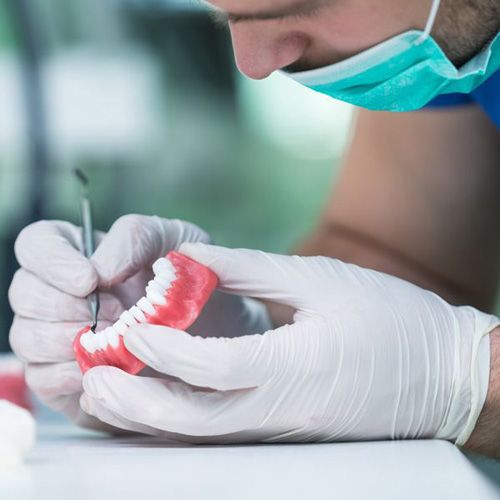Lab technician creating denture