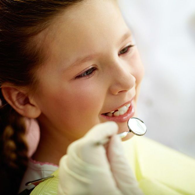 young girl at a dental appointment